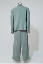 Light blue suit on a mannequin against a white background