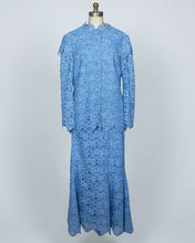 Blue floral dress on a mannequin against a white background