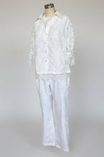 White lace outfit on a mannequin against a white background